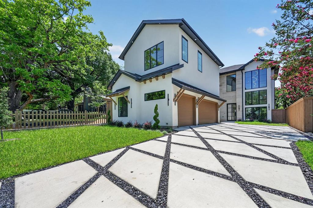 Stunning new construction offering approximately 4,000 sq ft of luxury living on a premium 0.18-acre interior lot in one of Dallas’ most sought-after neighborhoods. Thoughtfully designed open-concept floorplan showcases soaring 24-foot ceilings, expansive black-on-black Pella windows, abundant natural light, and designer finishes throughout. Dramatic living area features elegant chandelier lighting, LED accents, and a striking metal floating staircase with built-in LED lighting, creating the perfect blend of modern luxury and functionality.
The gourmet kitchen is designed for entertaining with an oversized quartz waterfall island, Belmont custom cabinetry, Venetian plaster vent hood and chimney, premium appliances, and a spacious walk-in pantry seamlessly flowing into the main living and dining areas.
Private primary suite offers a true spa-like retreat with heated floors, steam shower, dual vanities, and custom walk-in closet. Upstairs features a spacious game room or media room ideal for entertaining, movie nights, or additional lounge space.
Additional luxury features include Cellar engineered hardwood flooring, smart home capabilities, tankless water heater, EV charging station, full sprinkler system, oversized 3-car garage, custom diamond-pattern driveway, laundry room with built-in dog wash station, and covered backyard patio with built-in grill perfect for outdoor entertaining.
Estimated completion end of May 2026. Buyer and buyer’s agent to verify all information.