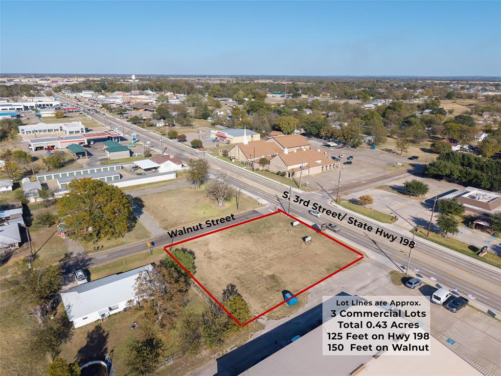 Discover this prime commercial lot for sale in fast growing Mabank, Texas. 

Located on the corner of S. 3rd Street and Walnut with approximately 125 feet of road frontage on a major state highway that sees close to 30,000 vehicles per day according to TxDOT. 

High visibility and heavy traffic make this an ideal location for a new business, investment property, or future commercial development. Utilities are available at the road, giving you quick access to water, sewer, and electric services. The land sits inside an Opportunity Zone, offering potential tax benefits for qualified investors and adding tremendous long term value for anyone looking to build or hold commercial real estate in the Cedar Creek Lake area. Surrounded by thriving nearby communities including Gun Barrel City, Kaufman, and Athens, this site benefits from a strong customer base and consistent growth. Mabank is known for its pro business environment, making the development process straightforward for retail, restaurant, fast food, salon, office, medical or your next business venture. This commercial property is perfectly positioned for developers, franchise owners, and investors seeking a high traffic location with excellent exposure and future growth potential. Its central location provides convenient access to nearby schools, restaurants, established businesses, and major routes, making it easily accessible for customers and deliveries. Whether you’re planning immediate construction or securing a strategic investment for the years ahead, this site offers the space, access, and visibility your business needs to succeed. Buyer to verify zoning and permitted uses.