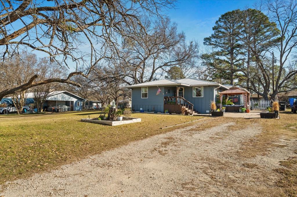 Seller is offering $10,000 in concessions at closing!! Charming Lakeview Home – Like New Construction! Welcome to this beautifully rebuilt 3-bedroom, 2-bath home offering lake views and effortless lake access in a desirable golf cart community. Taken down to the studs and completely rebuilt in 2023, this home feels just like brand-new construction, with modern finishes and thoughtful upgrades throughout. Enjoy a bright, open layout featuring all-new appliances, updated systems, and the added convenience of two breaker boxes for enhanced functionality. Outside, you’ll find a good-sized yard perfect for entertaining, relaxing, or simply enjoying the peaceful surroundings. The outside storage building with electricity provides excellent space for hobbies, tools, or lake gear. Not only do you get a scenic lakeview lifestyle, but you’re also just minutes from two different towns, offering easy access to shopping, dining, and everyday amenities. This property truly offers it all—modern comfort, outdoor enjoyment, and an unbeatable location. Don’t miss your chance to own a like-new home with lake living at its best! Seller will be Air BNB this home while on the market, its a great place to go for the weekend and enjoy the lake and being outdoors, while also having an adorable house to enjoy. 
This home is a great investment or the perfect place to call home!!
