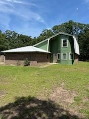 Fixer Upper with Major Potential! Charming two-story home nestled on a beautiful .78-acre wooded lot in a desirable neighborhood within the sought-after Wills Point Independent School District. This inviting property offers a warm and welcoming feel with rustic touches throughout, including wooden beam ceiling accents and a cozy brick fireplace flanked by built-ins in the spacious living room.

The kitchen features an island, breakfast area, and stainless appliances including a dishwasher and electric range, making it perfect for everyday living and entertaining. A large laundry area adds extra convenience and storage space. Repair is needed on the ceiling from a condensation line leak. New flooring, paint and other repairs are needed to make this house fully functional.

The home also offers a fun retro-style bathroom full of character, along with a comfortable  downstairs primary suite featuring a walk-in closet. Three bedrooms upstairs could also be office, library, childrens rooms or guest rooms. A full bathroom services the top level of the home,
Outside, enjoy the peaceful setting of the heavily wooded lot with plenty of room to relax, play, or garden. Complete with a one car garage, this property combines charm, space, and a fantastic location convenient to town and commuter routes.