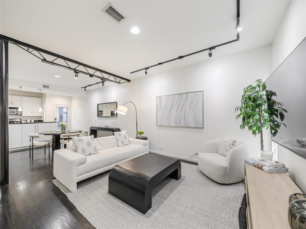 Don't wait or you'll miss out on the opportunity to own this amazing condo unit located within the best part of Dallas' uptown scene.  This spacious unit, which is one of the largest in the complex, is a move-in ready 2 story condo just walking distance to West Village, shops of Knox-Henderson, and access to the Katy Trail. Features include an open floor plan consisting of 1 bedroom, 1.5 bath loft-style. Kitchen and living on main floor. Updated with beautiful hardwood floors, modern fixtures, stainless steel appliances, granite countertops, spacious bedroom with hidden bookcase, desk area, skylight, bath with garden tub, large closet & washer-dryer. This unit comes with a reserved covered parking spot just steps from the back door.