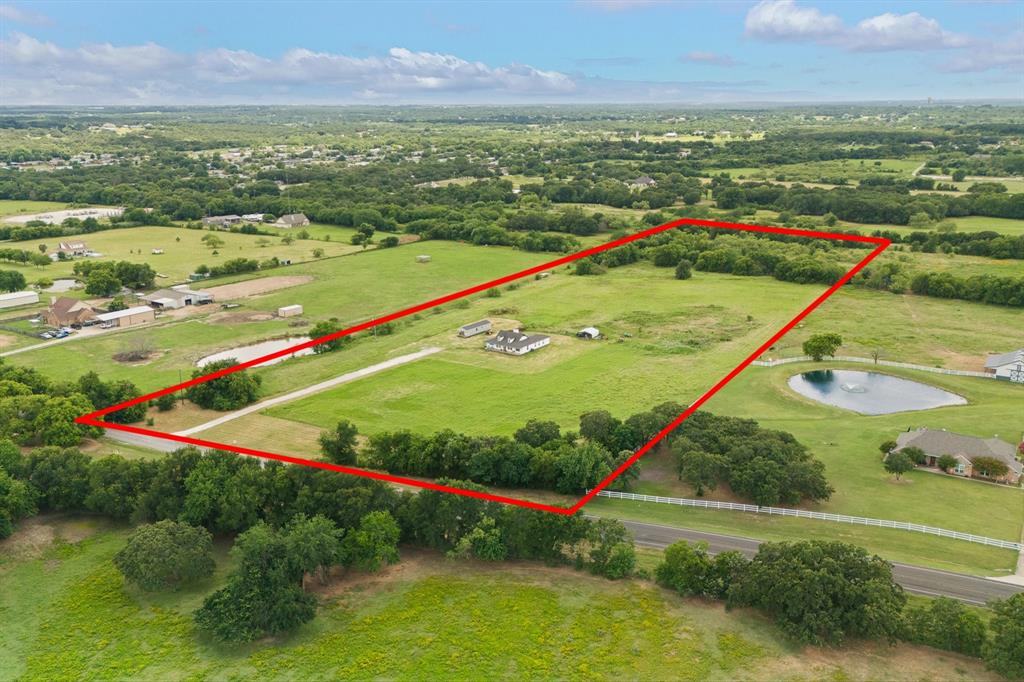 Acreage opportunities like this are RARE. Especially in Mansfield ISD with NO RESTRICTIONS, No City Taxes & No HOA— all for under $935,000. 14 Acre Property offers ENDLESS Potential with the land! We have had people mention; Family Compound, Wedding Venue location, Retreat compound, Subdivision with several Houses. Bring all your ideas, all of them are allowed on this slice of Texas situated within 10 minutes of several cities. Mansfield, Burleson, Alvarado & Fort Worth are all within 10-15minutes and major Highways close by providing easy access to shopping, dining, hospitals and everyday essentials while still enjoying the peace of country living. 

Whether you're dreaming of a private homestead, multi-generational family compound, hobby farm, or long-term investment, this property provides the flexibility to make it happen. The home is thoughtfully positioned on the front portion of the acreage, leaving approximately 10 additional acres available for livestock, recreation, workshops, future homesites, or income-producing opportunities.

Inside, the open-concept design creates a welcoming flow between the living, dining, and kitchen spaces. The spacious living area features two separate seating areas, offering flexibility for entertaining or everyday living. Wood-look ceramic tile flooring extends throughout the main living areas, complemented by granite countertops in the kitchen and bathrooms and fresh interior paint. The primary suite includes a versatile adjoining flex room that can serve as a fourth bedroom, nursery, home office, fitness room, or hobby space. The flexible layout allows the home to adapt to your changing needs for years to come.

A NEW ROOF will be installed prior to closing. This is your opportunity to secure land, lifestyle, and long-term value in one remarkable property. Don’t miss the opportunity.

**Tiny House is being Removed but can be Negotiated!**
