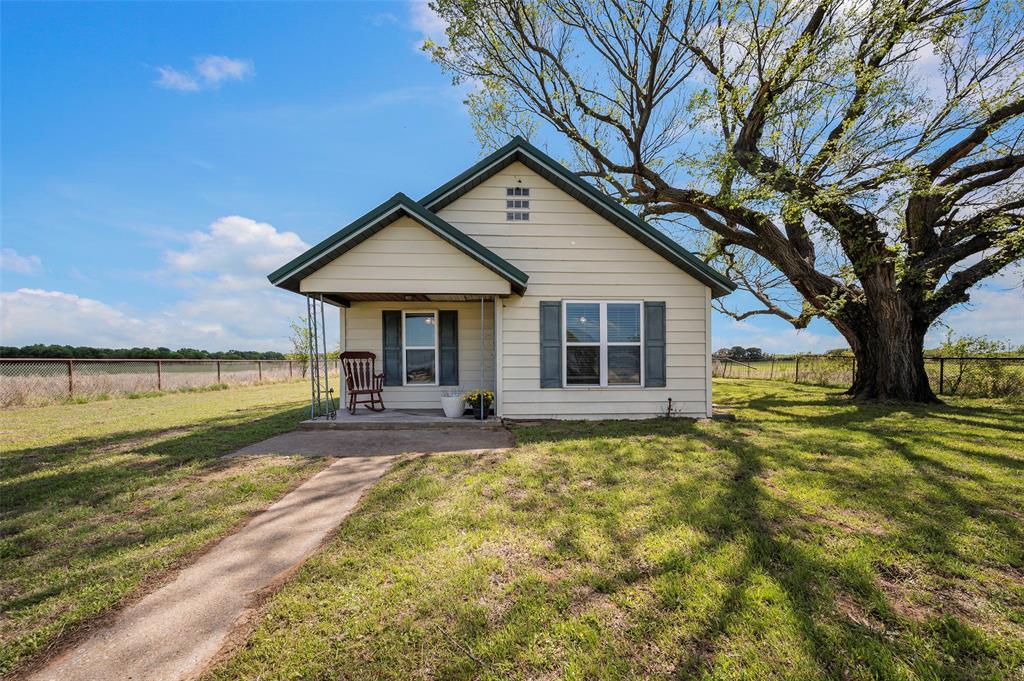 Welcome to 3913 FM 1956 in Saint Jo, TX—where country charm meets wide open space.50 acres of productive sandy loam pasture in the heart of Montague County — currently ag exempt for coastal hay and ready to perform from day one. The land lays well with wide open views, excellent grass cover, and soil that horse and livestock operations thrive on. Fenced and set up to work, this is the kind of ground that rarely comes available at this price point.
The updated farmhouse keeps things simple and charming — move-in ready so you can focus on the land, not a renovation. Whether you’re running horses, cattle, or baling hay, the infrastructure and exemption status are already in place.
Productive acreage. Proven soil. Real ag value.
Perfect for a getaway to Country living! Halfway between Saint Jo and Nocona on Paved roads.