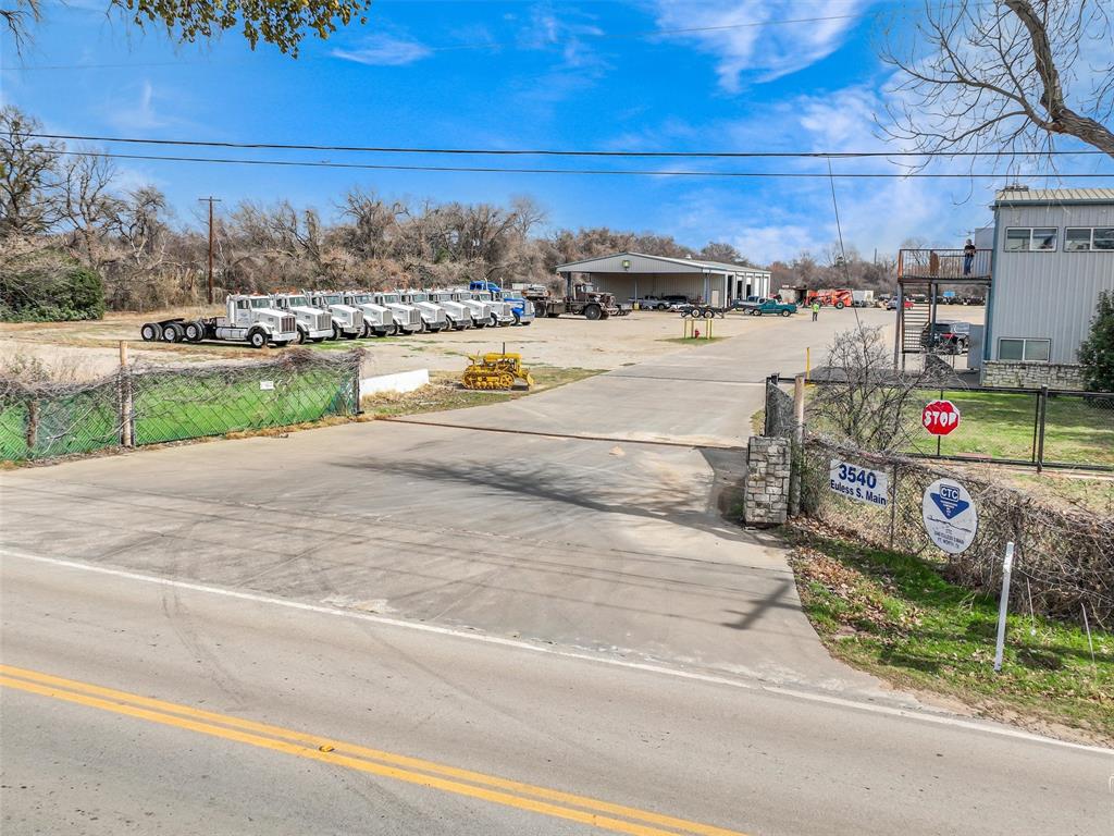 Premier industrial property opportunity!  This 12-acre industrial site, formerly home to a trucking company, is currently zoned under a Special Use Permit and offers significant potential for industrial operations, storage, or further expansion.  The property features two metal buildings, including one equipped with multiple offices and two bathrooms, as well as a large shop and warehouse with another bathroom.  Additionally, a large air compressor and two cranes will remain with the property. Notably, the site has a Voluntary EPA Completion Certification in place, ensuring the land is ready for its next use.  This property is ideal for industrial operations, storage or expansion.