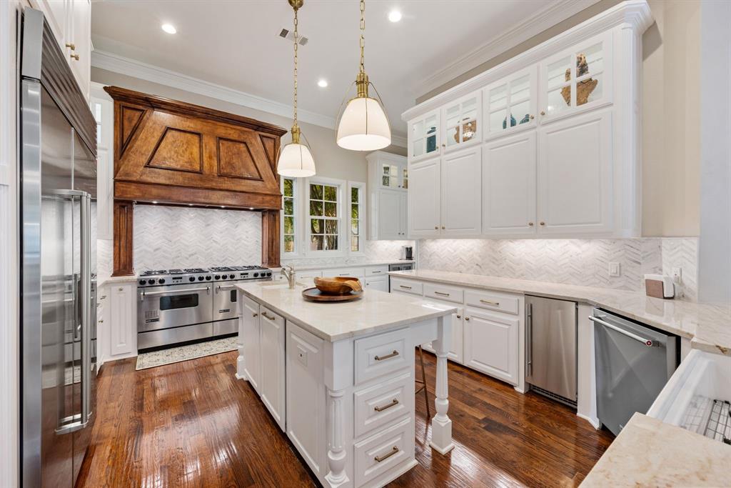 Located in the prestigious Monticello Estates community, this Southlake residence combines timeless architecture, refined interiors, and a spectacular outdoor setting. Ideally situated less than ten minutes from Carroll Senior High, Carroll High School, and Southlake Town Square, this home offers the perfect balance of elegance and everyday convenience.

A grand staircase and herringbone wood floors make a striking first impression, gracefully framing the formal living and dining rooms. The formal living room features a see-through fireplace shared with the breakfast room, creating warmth and ambiance throughout the main level. A wet bar conveniently connects the kitchen and dining area, while the open kitchen, family, and breakfast rooms overlook a wall of windows framing the picturesque backyard.

The primary suite serves as a private retreat with dual walk-in closets, a luxurious bath with soaking tub and separate walk-in shower, and a dedicated study accessible through a private wet bar. A first-floor guest suite with a full bath offers comfort and privacy for visitors.

Upstairs, a spacious game room with a wet bar and beverage refrigerator is complemented by a media room with attic storage access and additional secondary bedrooms, each with generous closets.

The exterior showcases stunning curb appeal with classic stucco architecture, elegant columns, and beautifully landscaped grounds illuminated by evening lighting. The backyard is designed for entertaining and relaxation, featuring a sparkling pool and spa, covered patio, lush greenery, and a separate grassy area perfect for play or pets.

With its thoughtful layout, timeless design, and premier location in one of Southlake’s most desirable neighborhoods, this home delivers an exceptional lifestyle for those seeking sophistication, comfort, and convenience in the heart of Carroll ISD.
