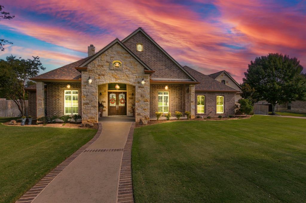 Stunning 5-bedroom, 6-bathroom estate, on 3.1344 acres within the highly sought-after Austin Colony in the China Spring ISD a harmonious blend of elegance and modernity.  Step inside to high ceilings and an open floor plan designed for both relaxation and grand entertaining, an office or dining room, fireplace, plantation shutters, crown molding, and concrete floors throughout.  The gourmet kitchen, a culinary masterpiece, showcases top-of-the-line stainless steel appliances, gas stove, custom cabinetry, and a spacious island that serves as the heart of the home. The primary suite is a private retreat with lavish en-suite facilities, including a deep soaking tub, walk-in rain shower, and dual vanities. Each additional bedroom is generously sized, with private bath access. Indoor also features a private media room, an oversized laundry room with sink and ample cabinets to ensure functionality for everyday living, a computer nook, mud room, and a whole home generator. Outdoor, dive into the sparkling saltwater fiberglass pool, or enjoy BBQ outdoor kitchen area for dining and gatherings under the TX stars. The property also includes a three-car garage, and 30 x 30 2 garage door workshop with a heat & cool mini split providing ample room for vehicles and additional storage. The 1300 square foot pool house includes its very own open concept living, dining, and kitchen area, with a bedroom, bath, and very large office with custom cabinets, and its own private patio. Every detail of this gated residence in this private community speaks to a life of luxury, where sophistication meets comfort.