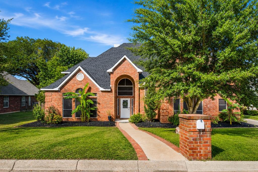 Move in ready and beautifully updated, this exceptional Arlington home is situated on a rare .80 acre cul de sac lot with NO HOA in the highly sought after Martin High School attendance zone of Arlington ISD. Offering over 3,700 square feet of thoughtfully designed living space, this one of a kind property combines timeless style, modern updates, and incredible outdoor space. Recent improvements include a NEW roof, NEW HVAC system, fresh interior paint, and beautifully remodeled bathrooms featuring elegant quartz countertops. Step inside to soaring ceilings, abundant natural light, rich wood and tile flooring, custom built in shelving, and a dramatic floor to ceiling brick fireplace. A wall of windows showcases peaceful backyard views while creating a bright, inviting atmosphere. The formal dining room features custom built in cabinetry and buffet. The updated kitchen offers beautiful cabinetry, solid surface countertops, generous prep space, and a charming breakfast nook. The spacious first floor primary suite is a true retreat with a renovated ensuite bath featuring dual vanities, soaking tub, separate shower, and walk in closet. Upstairs, a private secondary primary suite with its own full bath is ideal for multi generational living or guests. Two additional bedrooms share a full bath, while an oversized bonus room offers flexibility as a game room, office, or playroom. Enjoy a dedicated enclosed media room with no natural light for the perfect theater experience. Outside, enjoy a massive tree shaded backyard with room for a pool, outdoor kitchen, or garden. A remote controlled automatic gate provides additional parking for a boat, trailer, RV, camper, or extra vehicles. Buyer and buyer's agent should verify all information, including schools, measurements, and features.