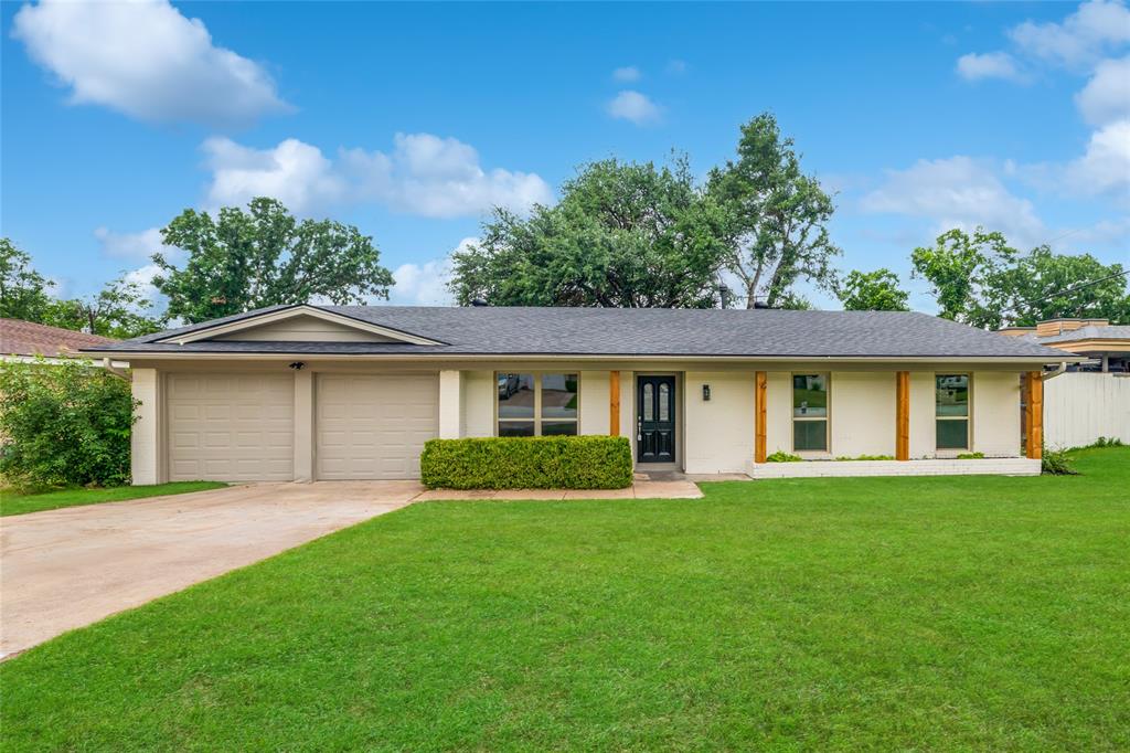 Welcome to this beautifully updated 3-bedroom, 2-bath home offering modern style, thoughtful upgrades, and true turnkey convenience. From the moment you step inside, you’ll notice the high-end luxury plank flooring, fresh interior and exterior paint, textured walls throughout, and stylish new lighting fixtures that elevate every space. The spacious living room features soaring vaulted ceilings and a stunning German schmear accent fireplace, creating a warm and inviting atmosphere. The open-concept layout flows seamlessly into the fully remodeled kitchen, designed to impress with custom cabinetry, subway tile backsplash, brand new appliances, and custom board-and-batten peninsula perfect for meal prep, dining, and entertaining. Both bathrooms have been beautifully renovated. The secondary bath features all-new tile work and a long custom dual-sink vanity, while the primary suite offers a natural-finish vanity and a gorgeous walk-in shower. All bedrooms include brand-new carpet for added comfort. Enjoy year-round versatility in the enclosed patio sunroom overlooking the oversized backyard  ideal for entertaining, relaxing, or family gatherings. The powered backyard shed provides excellent potential for a workshop, hobby space, or additional storage. Additional major upgrades include all-new windows throughout the main house, a new roof, and a new HVAC system. Conveniently located just minutes from I-20, this home combines style, comfort, and accessibility in one exceptional package.
