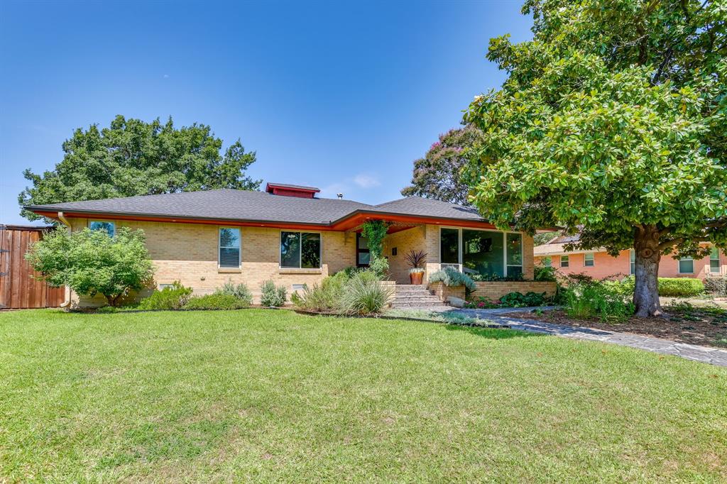 Step into timeless style with this beautifully preserved Mid-Century home, where authentic character meets modern, thoughtful updates. Offering 2080 square feet, this home features 3 spacious bedrooms, 2 full baths, 2 living areas, and 2 dining areas designed for comfortable living and effortless entertaining. The current owner, who purchased the home from the original family, has carefully maintained the homes true mid-century craftsmanship while making significant improvements. The beautiful, original hardwood floors remain throughout most of the home, complimented by a thoroughly modern kitchen with granite counter tops and refinished, original, cabinetry that honors the homes era. The guest bath showcases it's original vintage tile. The inviting charm of the keeping room just off of the kitchen centers around a wood burning fire place that is also plumbed for gas creating a warm and welcoming gathering space. Major updates include the rewired electrical system and service panel, all windows have been replaced with double-paned energy efficient units. The HVAC system and roof have been replaced. An eight foot privacy fence and automatic security gate has been installed. Outdoor living is just as impressive with a fully equipped outdoor kitchen featuring a working sink, refrigerator and TV plus a ceramic grill. Perfect for entertaining year round. The therapeutic hot tub, washer and dryer all convey with this move-in ready property. Located in the desirable Wynnewood North neighborhood in Oak Cliff, you will enjoy convenient access to the vibrant Bishop Arts District, Dallas Zoo and minutes from shopping. If you've been searching for an authentic mid-century home with original details, tasteful updates and unbeatable location this property is one you do not want to miss.