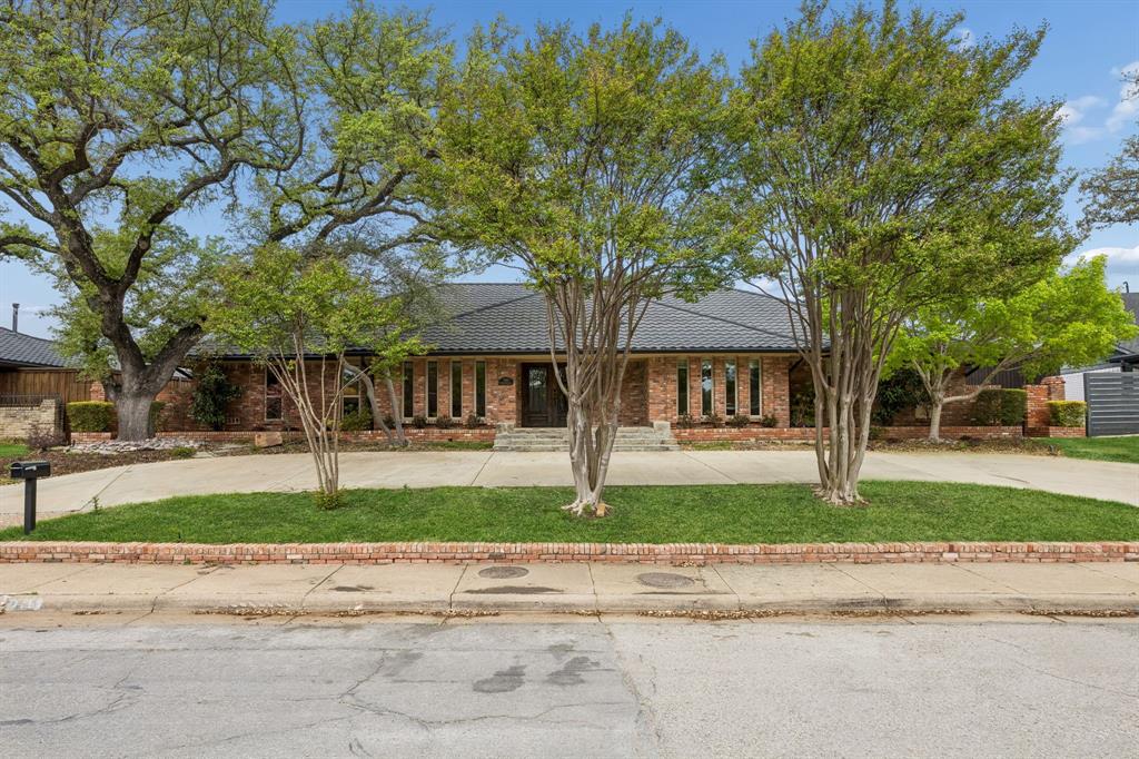 Now offered at just $1.895M following a recent $100K price improvement, this is an exceptional opportunity to own a beautifully updated single-story home with pool on nearly one-third of an acre in the heart of Brookshire Park. Rarely do updated 5-bedroom homes of this size, condition, and layout become available at this price point. Meticulously maintained, the home blends comfort, functionality, and effortless entertaining with a thoughtfully designed floorplan flooded with natural light. At the center of the home is a stunning updated kitchen featuring custom cabinetry, luxury stainless steel appliances, and expansive prep space, all opening seamlessly to the oversized great room with fireplace. French doors lead to a covered patio and sparkling pool, creating an ideal indoor-outdoor lifestyle. The flexible layout offers a private primary suite with two secondary bedrooms on one wing, while two additional bedrooms off the kitchen are perfect for guests, multigenerational living, office, gym, or playroom needs. Additional highlights include a powder bath, generous storage, and exceptional upkeep throughout. Ideally located just minutes from NorthPark Center, premier private schools, Hillcrest High School IB program, major hospitals, dining, and shopping. At this new price, the home represents compelling value in one of North Dallas’ most established and convenient neighborhoods.