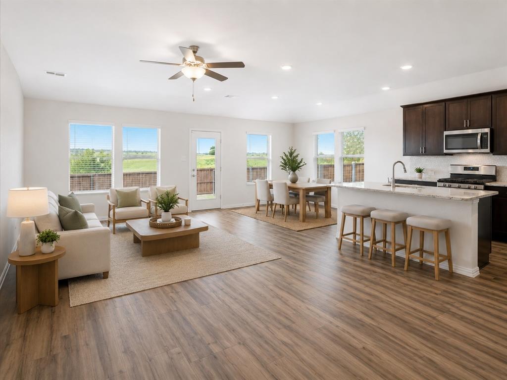Built in 2024 by Meritage Homes, this energy-efficient 4-bedroom, 3-bath home offers one of the best backyard views in the community. Perfectly positioned with views of the community pond and pool just beyond the backyard, this home delivers both privacy and everyday convenience.
Inside, the light-filled open floor plan features a spacious living area, a dining area, and a modern kitchen designed for gathering. The kitchen includes a gas cooktop, center island, and great flow to the covered back patio for easy indoor-outdoor living.
The split-bedroom layout offers excellent flexibility, including a private secondary ensuite bedroom with its own bathroom; ideal for guests, multigenerational living, or a private retreat. The primary suite is tucked away at the rear of the home with peaceful backyard views, a spacious ensuite bath with dual sinks, an oversized shower, linen closet, private toilet room, and a large walk-in closet. Two additional bedrooms are located near the front of the home with a shared bath featuring a linen closet.
Additional highlights include a tankless water heater and energy-efficient features. Enjoy community amenities including a pool, pond, walking trails, dog park, and more. Located in Eagle Mountain-Saginaw ISD and zoned to the newly built high school, this home is a standout opportunity in a growing community.