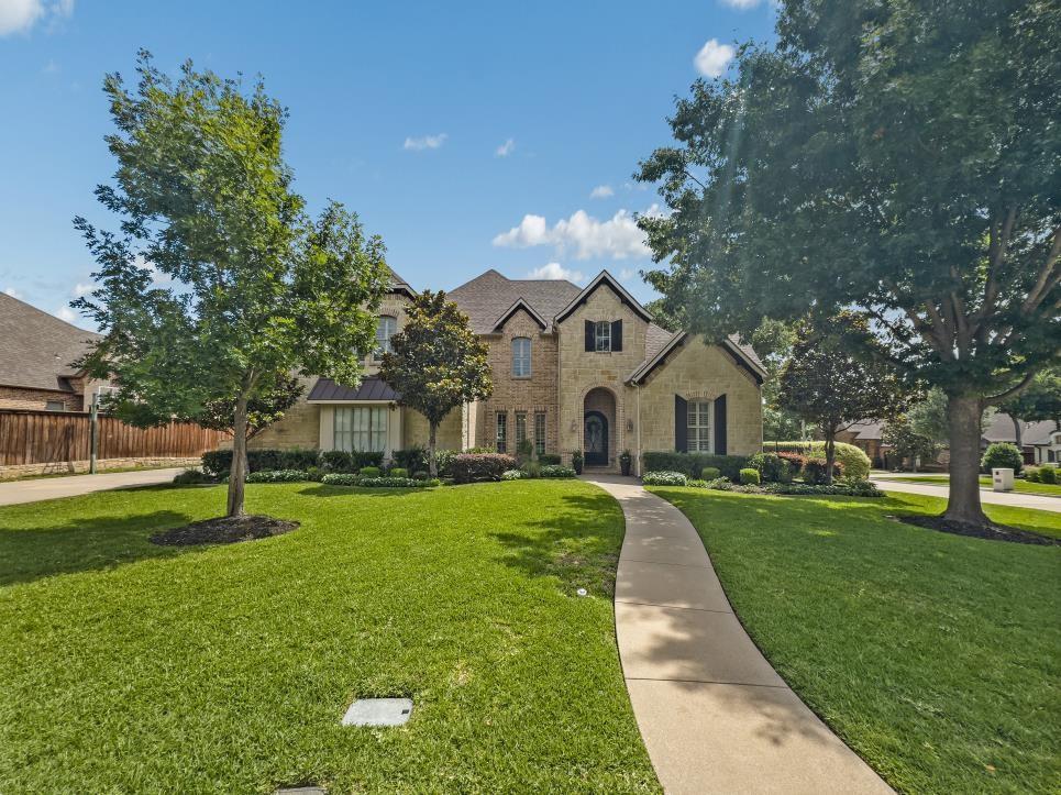 Welcome to this stunning luxury home in the highly desirable Strawberry Fields neighborhood of Mansfield. Featuring 5 spacious bedrooms and 4 full bathrooms, this thoughtfully designed floor plan offers exceptional comfort and functionality, including 2 bedrooms and 2 full baths on the main level.
The expansive primary suite serves as a private retreat with a beautifully updated custom closet and a spa-inspired bath. The gourmet kitchen is the heart of the home, showcasing beautiful quartz countertops, elegant stone accents, custom cabinetry, designer finishes, and abundant workspace for entertaining and everyday living.Decorator touches are evident throughout, including custom draperies, elegant lighting, and refined finishes that create a sophisticated yet welcoming atmosphere. Multiple living and dining spaces provide flexibility for both family living and entertaining guests.
Step outside to your private backyard oasis featuring a beautiful swimming pool, perfect for relaxing or hosting gatherings year-round. Situated in one of Mansfield's most sought-after communities, this exceptional property offers luxury, style, and convenience in an outstanding location close to parks, shopping, dining, and top-rated schools. A rare opportunity to own a truly remarkable home in Strawberry Fields.