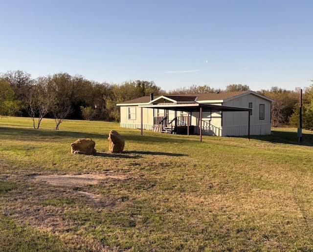 Double wide with 3.25 acres...This would make great little HORSE property it has some fencing but will need more. 3 bedrooms 2 baths 2 car carport....This home has had lots of remodeling done, including walk in showers, new paint, new flooring, also nice covered front porch.  Property can also be divided and sold with 1.75 acres $219,000 if needed.... MUST BE CASH, CONV or POSSIBLE OWNER CARRY...Very private call Gilda for a showing.  Inside pics coming soon or go take a look anytime.