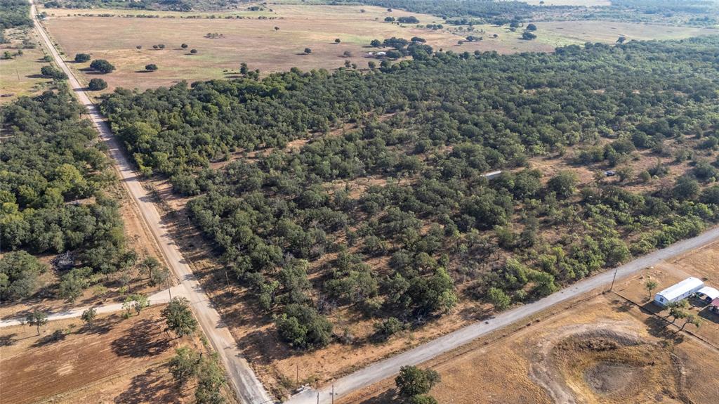 Only a few miles off of Hwy 279, this 2.13 acre piece of northwest Brown county is ready for your Farm and Home ideas! This property sits just north of Lake Brownwood between Cross Plains and Brownwood, with easy access to either. Water access through Brooke Smith SUD and there is access to power! Beautiful mature Post oaks are scattered throughout the property as well as a mix of mesquite and cedar trees that help provide privacy and seclusion. The surrounding area is well kept and beautiful countryside. Gently rolling terrain, Multiple options for home sites, put your house up front with a deer feeder and barn towards the back. With this lot being a corner lot, it gives you multiple access options into the property! Very quiet and peacful location. This property could be your perfect weekend getaway or the place you finally build your dream home. No restrictions. Located approximately 10 minutes to beautiful Lake Brownwood, 20 minutes to Brownwood, 20 Minutes to Cross Plains, 1 hour to Abilene, and just over 2 hours to Fort Worth. Come check it out today!