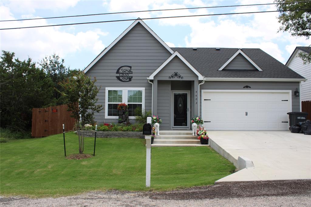 Welcome to 4403 Mountain Hollow Dr. This beautifully maintained home is just a short walk to Granbury Lake and offers comfort, charm, and thoughtful upgrades throughout. Inside, you’ll find an open concept layout, a dedicated office, spacious living areas, and an attic lift elevator for easy storage access. Step outside to an oversized covered patio with an extended flagstone entertaining area, professionally landscaped yard, custom horse trough flower beds, a matching storage shed, and a fenced dog run. Whether you’re relaxing with your morning coffee or hosting friends and family, this backyard is made to enjoy. Don’t miss your chance to own this move-in-ready home in one of Granbury’s most desirable lake communities!