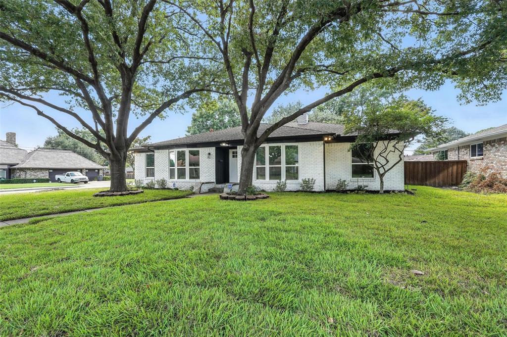 Welcome to this beautifully renovated single-story home offering a perfect blend of modern elegance and timeless comfort. Situated on a serene tree-lined street in East Dallas, this 4-bedroom, 3-bathroom residence boasts an open-concept layout with designer finishes throughout.

Step inside to a spacious living area anchored by a sleek floor-to-ceiling fireplace, flowing seamlessly into the dining space and gourmet kitchen. The chef’s kitchen features quartz countertops, custom white shaker cabinetry, stainless steel appliances, and a large island with seating—ideal for both cooking and entertaining.

Retreat to the luxurious primary suite, complete with a spa-like bathroom featuring a freestanding soaking tub, oversized walk-in shower, dual vanities with quartz counters, and gold-accent fixtures. Additional bedrooms are generously sized and share beautifully updated baths with modern tilework and designer lighting.

Enjoy the private backyard shaded by mature trees—perfect for outdoor gatherings, gardening, or simply relaxing. The home also offers a two-car garage, updated systems, and energy-efficient windows for year-round comfort.

Located minutes from White Rock Lake, the Dallas Arboretum, shopping, dining, and top-rated schools, this home delivers both style and convenience.