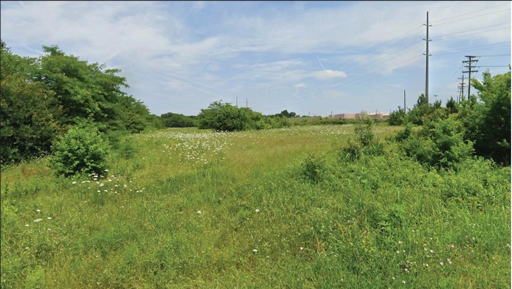 We are pleased to offer for sale an exceptional ±18.56-acre development opportunity strategically located along North Travis Street and E Canyon Grove Rd in Sherman, Texas. This two-parcel assemblage (17.662 acres and 0.895 acres) sits in the heart of the Hwy 75 & 82 corridor, the most active retail and growth hub in the region.

The property is directly adjacent to Walmart and lies within a federally designated Opportunity Zone, providing potential tax advantages for investors. Just across the street, Sherman Town Center offers a powerful retail draw with major anchors including Target, Hobby Lobby, Home Depot, and Sam’s Club. The site is also in close proximity to the planned Heritage Ranch master-planned community, a 439-acre project slated for commercial, entertainment, residential, park, and open space uses.

With excellent visibility, utility access, and flexible zoning potential, the site is ideally positioned for mixed-use office condos, professional services, or retail development. Sherman is experiencing unprecedented commercial and residential expansion, fueled by new employment growth and infrastructure investment — making this property a rare chance to secure a foothold in one of North Texas’ fastest-growing markets.