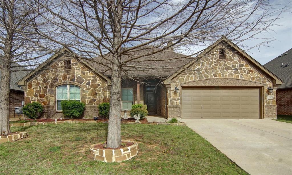 Beautiful open concept home in Willow Creek Crossing. This home features a split floorplan offering generous sized bedrooms. The large primary suite hosts an ensuite bath with granite dual vanities, doorless shower and soaker tub, and a large walk-in shower. The living space offers vaulted ceilings, a stone fireplace and large windows overlooking the covered back patio. The kitchen features custom stained cabinets, granite countertops, an island with plenty of space and a window seat in the dining area. Step out back and enjoy the spacious yard! Located near Chisholm Trail Parkway, shopping, and dining.