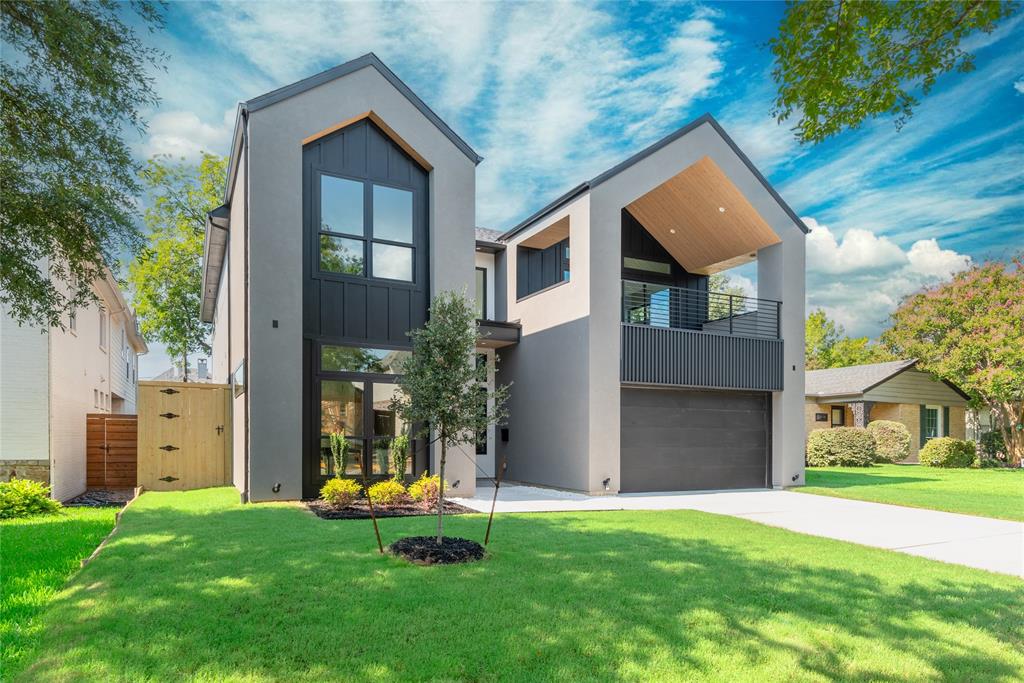 Moody elegance meets modern luxury in the heart of the Lakwood Hills. Welcome to 6942 Coronado, a striking new construction by Avant Group, offering 4,724 square feet of bold design and refined craftsmanship, zoned to the acclaimed Lakewood Elementary and minutes from White Rock Lake, Lakewood Village, and East Dallas’ premier dining and retail. This 5-bedroom, 5.1-bath residence brings a Scandinavian Modern aesthetic to the neighborhood, highlighted by deep tones contrasted with light beachwood stain, dramatic textures and layered sophistication. At the heart of the home, the gourmet kitchen commands attention with Nero Velluto granite island countertop, hand-built cabinetry, a massive center island, WOLF® dual fuel range, and a 48-inch built-in Café® refrigerator. A sleek dry bar with LED-lit floating shelves and wine fridge adds flair and function, and the walk-in pantry for all your dry goods. Downstairs, the primary suite offers a luxurious retreat, complete with a spa-inspired bathroom with floating vanity, oversized rainfall shower, and soaking tub and direct access to the laundry room. A guest suite with ensuite bath, mud room, and stylish powder bath complete the first level. Upstairs, a game room with wet bar leads to a covered veranda perfect for enjoying memorable sunsets. Three additional bedrooms each feature ensuite baths and walk-in closets, perfect for your growing family. Engineered for comfort and performance, the home includes a Control4® Smart Home system, CAT-6E pre-wiring, highly efficient foam insulation, slab foundation WITH piers, dual tankless water heaters, and a Maverick® 1-2-10 warranty. 6942 Coronado- Bold. Elevated. Unapologetically elegant.