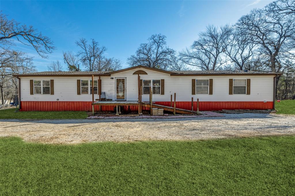 Experience the best of Texoma living just minutes from it all. This beautiful lake retreat is within walking distance to Lake Texoma, only one mile from the boat ramp and campgrounds at Juniper Point, and minutes from MegaStar Casino., four area golf courses, Pelican's Landing, and Cedar Mills Marina,—making this the perfect hub for lake life, recreation, and entertainment.Situated on nearly half an acre and shaded by mature trees, this inviting home offers plenty of space for RVs, boats, and all your recreational toys, with easy access in and out of the property. Inside, the expansive open-concept design features a large family and dining area anchored by a huge kitchen island that flows seamlessly into the breakfast room and living space—ideal for entertaining. The oversized pantry showcases a full wall of cabinetry and additional space for a second refrigerator or freezer. The spacious primary suite includes dual closets, double vanities, a soaking tub, and a separate shower. Two secondary bedrooms share a well-appointed bath with abundant storage, while the fourth bedroom shares a bath with the family areas. Outdoor amenities include a generous deck with ramp access, partial fencing, and a small accessory building ideal for a workshop or storing lake gear. Major updates provide peace of mind, including a new roof in Dec. 2024 and PEX plumbing lines installed in December 2024, along with a new water heater in June 2024. Currently combined with 172 Mohawk and will need a new survey. This home is being sold with lots 4,5,420 &421.  Whether you’re searching for a full-time residence, weekend getaway, or vacation investment property, this Texoma gem is a must-see.