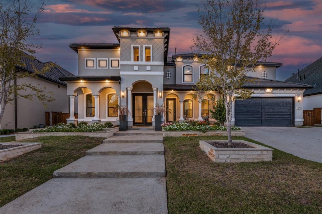 This stunning Mediterranean-style estate blends luxury with modern convenience, featuring elegant architectural details such as arched entryways, a terracotta tile roof, and a stucco exterior that create timeless curb appeal. Inside, soaring ceilings in the foyer, dining room, office, family room, and covered patio enhance the open and airy feel throughout. A standout feature is the private multi-generational (MIL) suite, complete with its own en-suite bath, walk-in closet, and separate entrance—ideal for extended family or guests seeking privacy. The home is equipped with smart technology for control of lighting, climate, irrigation, garage door, and security systems, and includes upgrades such as an enhanced lighting package, eggshell paint finish, and expansive 4-panel sliding glass doors that seamlessly connect indoor and outdoor living. The gourmet kitchen, inspired by luxury builder designs, showcases upper cabinets with glass accents and a striking 12-foot quartz island with waterfall edges, perfect for entertaining. Conveniently located just minutes from the Dallas North Tollway, the property offers easy access to shopping, dining, and city amenities while being nestled in a peaceful, amenity-rich community with resort-style features including pools, tennis courts, and a clubhouse, along with a spacious 3-car garage and flexible living spaces ideal for modern lifestyles.