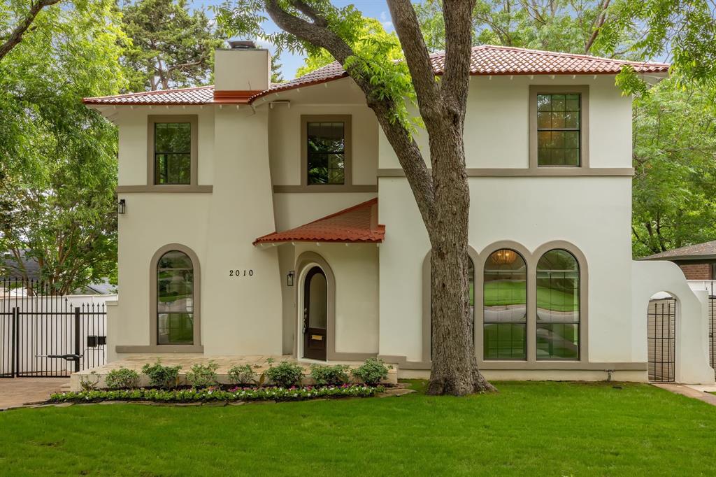 Beautifully updated 1930s Spanish Colonial in sought-after Stevens Park Estates featuring a rare 4-bed, 4-bath layout.

Timeless character meets modern living with arched windows and doorways, a coved gas fireplace, and French doors that bring in incredible natural light. The oversized downstairs bedroom—lined with five arched windows—offers the perfect flex space for a private office or guest suite, with a full bath nearby. The gourmet kitchen is equipped with stainless steel appliances, a convection double oven with microwave, and a 5-burner gas cooktop, flowing into a dramatic two-story family room with soaring windows, a built-in bar, and seamless access to the backyard.

Upstairs, the primary suite is a true retreat with vaulted ceilings, its own fireplace, a spa-like bath with soaking tub and oversized double walk-in shower, and a boutique-style closet. Two additional bedrooms each feature en-suite baths and generous storage.

The expansive backyard offers endless potential—plenty of room to entertain, relax, or add a pool. New roof and thoughtful updates throughout. Prime location near Stevens Park Golf Course, Bishop Arts District, and Downtown Dallas, with easy access to both airports. Zoned to highly desirable Rosemont Elementary School.