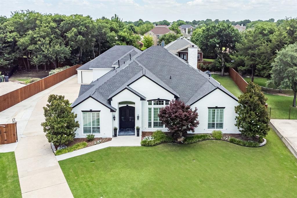 Rare Opportunity! This beautifully updated home sits on a huge half-acre cul-de-sac lot with a private backyard oasis plus a full detached guest house or mother-in-law suite - and NO HOA. A true one-of-a-kind property with exceptional indoor - outdoor living. The inviting interior features new custom iron front and back doors, rich wood and travertine flooring, decorative moldings, plantation shutters, and abundant natural light. The flexible floorplan includes a study with French doors, two dining areas, a spacious living room with fireplace and built-ins, a cozy sitting area, and a sunroom overlooking the backyard. The kitchen offers granite countertops, a center island, 6-burner gas cooktop, and stainless-steel appliances. The peaceful owner’s retreat features a bay-window sitting area and a spa-like bath with dual vanities, soaking tub, and frameless glass shower with body sprays. Two secondary bedrooms downstairs each have their own full bath. Upstairs you’ll find a huge 4th bedroom with full bath, media room with projector and screen, and generous walk-in attic storage. Major updates include 3 newer AC units and 2 newer water heaters. The 3-car garage features epoxy flooring. Step outside to your resort-style backyard with a large covered patio, sparkling saltwater pool with waterfalls and slide, stamped concrete decking, lush landscaping, and low-maintenance turf with a putting green. The detached guest house is a rare bonus - complete with a full kitchen, living and dining area, bedroom, bathroom, its own 1-car garage, and a covered patio. This special property offers space, privacy, flexibility, and amenities you won’t find elsewhere.