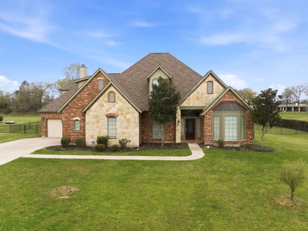 Come add your personal touch! Experience refined living in this custom home nestled within the prestigious gated community of Rose Creek Estates. Perfectly positioned on a one-acre homesite, this residence seamlessly combines timeless elegance, everyday comfort, and thoughtful design. From the moment you enter, soaring ceilings, a sweeping staircase, and rich hardwood flooring create a grand first impression. Natural light fills the private study and formal dining room, while fresh interior paint and brand-new carpet throughout, move-in-ready feel. At the heart of the home, the spacious living room is anchored by a stunning floor-to-ceiling stone fireplace and showcases peaceful views of the beautiful backyard. The chef-inspired kitchen is designed for both entertaining and everyday living, featuring stainless steel appliances, granite countertops, abundant cabinetry, and a charming breakfast nook. The luxurious primary suite offers a private retreat on the main level, complete with direct patio access and a spa-like ensuite bath featuring an oversized walk-in shower, soaking tub, dual vanities, and an expansive custom walk-in closet with built-in storage. Upstairs, generously sized secondary bedrooms with a spacious game room and dedicated media room, creating the perfect setting for movie nights, gatherings, and relaxation. Step outside and unwind in your own outdoor sanctuary. The covered patio overlooks a beautifully maintained backyard, offering the ideal backdrop for entertaining guests or enjoying peaceful evenings. New Carpet, New Paint, Both HVAC systems replaced in 2021, Water Heater 2019, Roof 2021