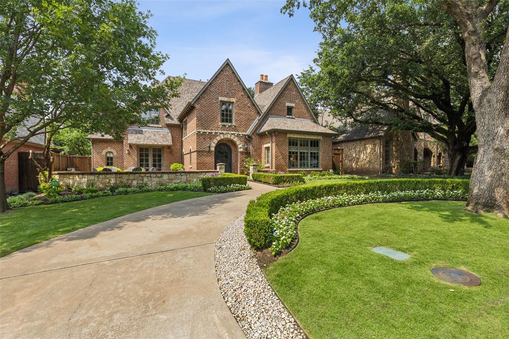 Imagine waking up, grabbing a hot cup of coffee, and looking out your windows to wonderful views of Preston Hollow Park.  Or soaking up the sun in your landscaped courtyard or relaxing in your private pool.  Welcome to 6611 Park Lane!  Custom built by Registry Custom Homes in 2004, this home features a first-floor primary suite designed for relaxation & comfort. The formal living room with a stately fireplace and vaulted ceilings, sets the tone for elegant living. Enjoy the open-concept family room, also with a fireplace, that seamlessly connects to the chef’s kitchen & breakfast area, making it ideal for gatherings & entertaining. The second floor offers three additional bedrooms, two full baths, a game room, & a dedicated arts & craft room. Step outside to a landscaped backyard, where you can unwind on the covered patio with a fireplace, cook on the built-in grill, or take a dip in the inviting pool and spa. Also includes a 2-car rear entry garage with an automatic gate.