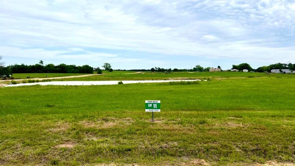 SELLER IS OFFERING A $2000 SPRING ONLY TREE PLANTING ALLOWANCE. The pond is finished, the recent rains have filled it up, and the Seller has begun stocking the bait populations. Come build your dream home on this 3.2 acre corner lot. There are some restrictions, but no HOA. Homesites are restricted to 1,500 sq. ft. living minimum, site-built homes only. You are just 2 miles east of the world-renowned Lake Fork, 75 miles from DFW, 8 miles from the new SRA recreational facility that has 6 boat ramps, 8 miles to SRA waterpark. Just 17 miles from charming Sulphur Springs, and 35 miles to Canton First Monday Trade Days. Two golf courses within 10 miles will satisfy players of all skill levels. Electric, water, fiber internet are available at the front of the lot. Barndominiums are allowed with plan approval. Approved plat is available. Ideal for those looking to create a custom home in a tranquil environment. Bring your own builders, or we can suggest builders to you.