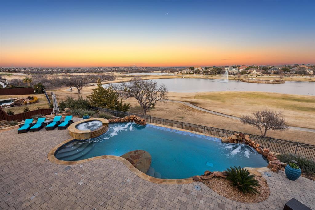 Guard gated Luxury Garvey custom home on top of Castle Hills' Enchanted Hills with amazing scenic views of Bright Lake-Avalon Park & Golf Course. This Garvey custom-built 5 bed, 5.2 bath home with a 4 car garage has a home office-study with groin vault ceilings, 2 kitchens, family, huge game, media room, Nearly 5700 SF home with full views atop the hill from every room! Enjoy soaring entry, hardwood floors, sweeping stairs, multiple stair cases, fresh paint, remodeled kitchen, home office with groin vault ceiling, built in secretary’s desk. The Large family room has a wall of windows & gas fireplace with golf & lake views. Private Master Suite sep. from other secondary rooms with views, wood floors, spa en-suite bath includes updated bath: glass shower with rainhead shower, modern lit cabinets, lit mirrors, stand alone sep. modern tub, generous master closet has built ins. Chefs kitchen with Sub Zero, Stainless WOLF appliances includes 6 burner gas cooktop, new marble countertops & backsplash, new sink, faucet. White cabinets, butlers pantry, countertop bar & dining room all open to family room & kitchen. Two secondary bedrooms down with brand new Shaw carpet and ensuite bath. Thoughtful pool full bath with shower has access from pool. Second floor has a full kitchen, fridge, oven, dishwasher, ice machine and pantry open to an expansive game or living room area, huge balcony, grand sep. media room with new Shaw carpet, access to full bathroom, two secondary beds up with 2 fulls ensuite baths & a laundry room up. Grand views from the 2nd fl. balcony & golf views, perfect home for the hostess-entertainer or multi gen family home.  Enjoy an infinity edge pool and spa, fire pit, grassy area, covered paver patio perfect for watching the sunset and star gazing! Lake & Golf views. 4 car garage, Gated electric fence driveway, extra parking pad, front circular drive. Move-in Ready for immediate occupancy. Castle Hills offers a voted-on college tuition reimbursement program.