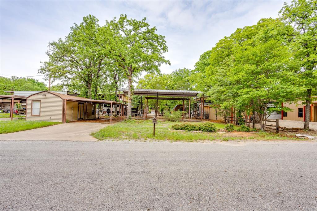 Welcome to the good life at Lake Granbury RV Ranch!!  This gated community offers the secure quiet life outside the city limits with access to all the amenities. The HOA is mandatory, but the grounds are well kept as well as the community pool and clubhouse. Move here and make this RV Ranch your home base to come and go as you please. Up for sale are the two lots, 35 and 36. Another lot may be purchased as well. See the corresponding MLS 21247954.