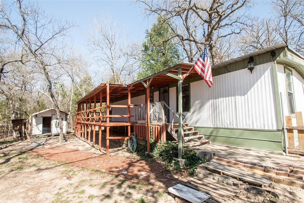 Come see this one today.  Totally updated 1992 , 2 bedroom, 1 bath home.  Home was taken down to bare walls and all new wood, flooring, plumbing, electrical, kitchen, bathroom, fresh paint inside and out etc.  You are basically getting a 1992 manufactured home with all new materials inside and out.  Storage building located on property houses the washer and dryer and still has plenty of storage space.  Roof trim on the storage building needs a little TLC.  Large new 10x33 foot covered porch-deck will be great to sit out and enjoy the cool breezes and nature on the large ranch behind your property.  Yard has been fenced in for small pets.  Home is ready to go with electric, water, and septic all ready for your use.  The Hickory Hills subdivision is located on the beautiful 365 spring fed Callender Lake.  The community has great fishing, swimming, boating, children's park, community swimming pool, restroom and shower facility by the pool, fishing dock, lake swim area, and much more for your enjoyment.  Come see this great property today.