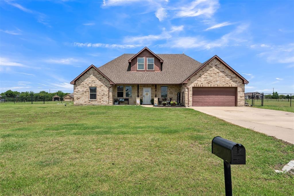 Experience the perfect blend of country living and modern comfort in this stunning 4-bedroom, 3-bath custom home situated on a spacious, fenced homesite in the highly sought-after Saddle Ridge community. Thoughtfully designed with an open-concept floor plan, this home features a large living area that flows seamlessly into the chef’s eat in kitchen, complete with abundant cabinetry, granite countertops, stainless steel appliances, double ovens, and an oversized island perfect for gathering and entertaining.

The private primary suite offers a relaxing retreat with a spa-inspired bath featuring dual vanities, a soaking tub, separate shower, and a generous walk-in closet. Two additional bedrooms are located on the main level, while the upstairs bedroom, full bath, and expansive loft provide the perfect space for guests, a game room, home office, or multi-generational living.

Step outside to enjoy the impressive covered patio overlooking the expansive backyard, offering plenty of room for outdoor entertaining, recreation, pets, or future additions. The fenced yard, fire pit area, and wide-open views create the ideal setting to enjoy peaceful Texas sunsets. Conveniently located with easy access to Terrell, Forney, and major commuting routes, this property delivers the tranquility of country living without sacrificing convenience.