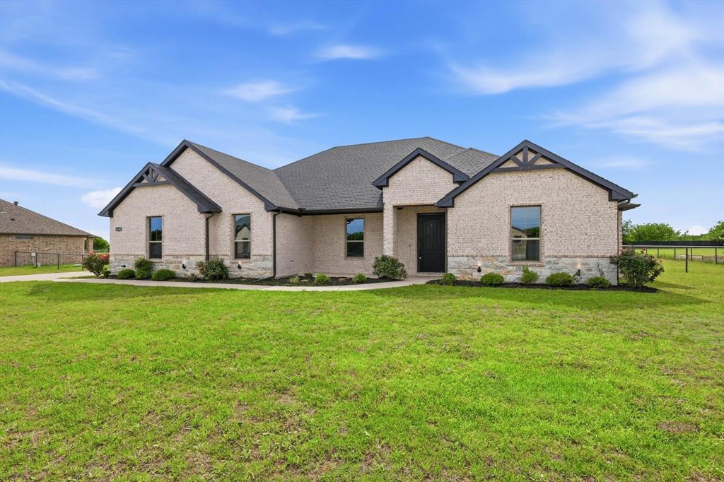Just listed in one of Krum ISD’s most sought-after neighborhoods, Indian Trail Estates! Custom built by AGD Homes LLC, this beautifully updated preowned home has undergone an extensive top-to-bottom renovation including fresh interior paint, new flooring, and numerous additional upgrades throughout, showing like new while featuring one of the builder’s most popular and spacious floor plans. Step outside to enjoy the oversized covered patio complete with an outdoor kitchen and wood-burning fireplace, perfect for entertaining year-round. The property has also been cross-fenced, creating an ideal space for a dog run, garden, or additional outdoor flexibility. Conveniently located just minutes from North Denton’s popular Rayzor Ranch shopping, dining, and entertainment district, this home offers the feel of new construction without the new construction price tag. Opportunities like this in Indian Trail Estates do not come along often!