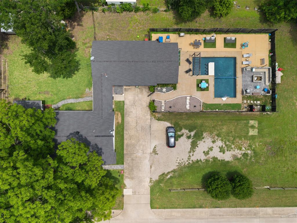 Discover a truly one-of-a-kind property offering endless possibilities on nearly 0.75 acres with NO HOA, incredible privacy, and a backyard designed to impress! Whether you're searching for a personal retreat, multigenerational living setup, or income-producing property, this rare gem delivers. The unique floorplan features a 1,857 sf main home with 3 Bedrooms and 2 Bathrooms, connected by an interior breezeway to a fully equipped guest house, studio, or pool house complete with its own Great Room, Kitchen, and Full Bathroom—perfect for guests, long-term stays, private office space, or rental income. Inside, the beautifully updated interior showcases new Luxury Vinyl Plank flooring throughout, new windows, plantation shutters, granite countertops, stainless steel appliances, and flexible living spaces designed for modern lifestyles. The spacious Living Room opens to an additional Flex Room ideal for a home office, reading nook, playroom, or secondary living space. Step outside and experience the backyard paradise the sellers thoughtfully created with over $200K invested into outdoor living and entertaining! The resort-style setting includes a sparkling pool, expansive stamped concrete, built-in seating areas, fire pit, pergola, multiple patio spaces, and wood fencing. The covered outdoor living and grilling area is fully equipped with grill space, prep area, and room to relax—creating the ultimate space for entertaining, celebrations, or simply undwinding in complete privacy. Adding even more value, this oversized backyard and impressive amenities create unique income-producing opportunities through platforms like Airbnb or Swimply. Conveniently located near Lavon Lake and Firewheel Town Center for dining and entertainment, this exceptional property combines privacy, flexibility, recreation, and investment potential into one unforgettable package.