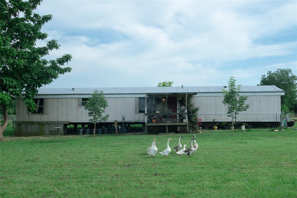 Welcome to your serene slice of country living! Situated on a sprawling 5-acre lot in Hunt County, this inviting manufactured home for sale at 5997 County Road 3214 offers the perfect blend of rural tranquility and accessible amenities. This charming 1,152-square-foot residence provides a comfortable, open layout, making it an excellent opportunity for anyone seeking Lone Oak TX real estate. The generous acreage presents endless possibilities, whether you dream of establishing a vibrant garden, raising chickens, keeping agricultural projects, or simply enjoying the expansive outdoor space and wide-open Texas skies. A spacious barn provides ample space for animals and equipment and is located near the large pond toward the back of the property. Embrace the peaceful lifestyle with plenty of room to roam and relax. For outdoor enthusiasts, the property is conveniently located near the renowned Lake Tawakoni and Wind Point Park, where you can easily enjoy boating, fishing, hiking trails, and picturesque sunsets. Enjoy the privacy of a country retreat while remaining just a short drive from local shops, dining, and the charming community of Lone Oak. This 5-acre property in Hunt County is a rare find, offering a flexible canvas to create your ideal homestead. Do not miss your chance to own a beautiful piece of Texas land with a cozy residence already in place. Schedule your private tour today to experience this wonderful property firsthand!
