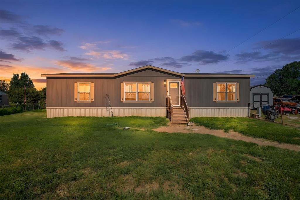 A 2021 Clayton Homes home situated on a dead end road which creates a feeling of total privacy with a country lifestyle on 2 acres! Storage building for added bonus of extra storage. This split bedroom 3 bedroom 2 bathroom layout is open planned with views for miles! At only 5 years old, you benefit from modern applianced, upgrades - including traditional Septic System with leach field and your own water well - which means no Water or Sewer utility bill! With part of your lot in Parker County at .39 in Wise County - which also lowers your tax bill! This home gives you all the benefits AND sits in highly desirable Poolville ISD. No restrictions & No HOA!