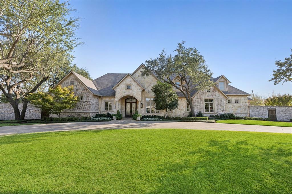 Welcome to this stately transitional residence in the prestigious Preston Hollow enclave. Built in 2006 and thoughtfully updated in 2015, 2022 and 2024. 4 bdrms, 3.1 ba, 5,102 sqft of luxurious living space on a sprawling .514 acre lot. Step inside to discover elegant formal sitting and dining room with open floor concept living. Culinary kitchen with marble counter tops & butcher block end, center island, built-in Thermador range, custom double refrigerator with four freezer drawers opens to breakfast rm, spacious living rm, and wet bar w built-in wine refrigerator & ice maker. Living rm w gas FP, overlooks back covered patio & pool. The first-floor primary suite offers sitting area, gas FP, French doors to covered patio, and luxurious bathroom w sep vanities, garden tub, sep shower and large walk-in closet. First floor is complete with a home gym, large cedar closet, study or versatile fourth bdrm and spacious utility rm. Upstairs, retreat to a media room w wet bar and sink, two bedrooms and utility closet. Backyard oasis features 1400+sqft of covered outdoor living with large kitchen island for seating and prep and storage space, built-in grill, living and dining area with four electronic screens, saltwater pool & large turfed yard. Attached 3-car garage with epoxy flooring, sink, built-ins and large walk-in closet for ample storage space. Complete with a full house Generac generator.