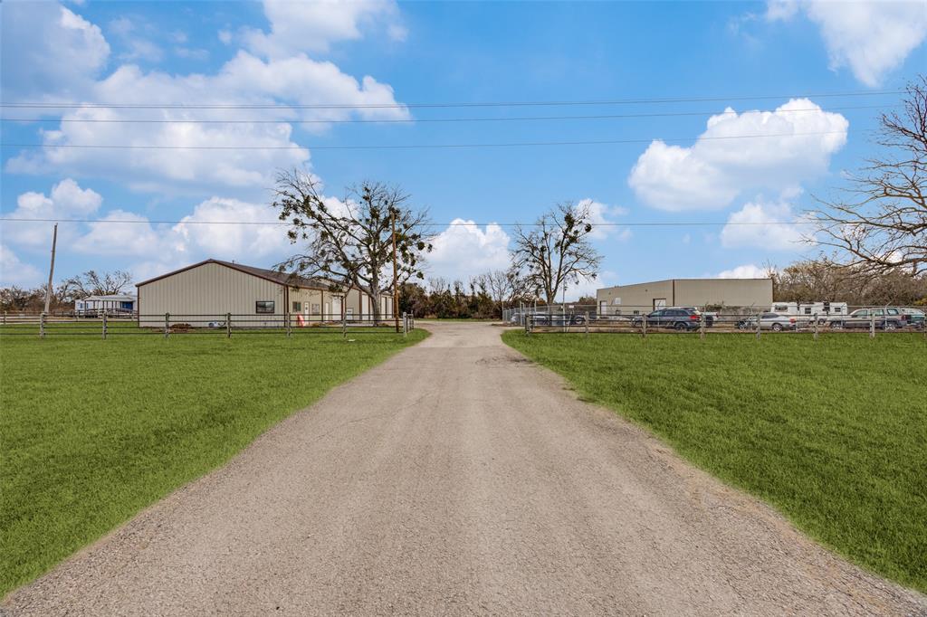 Great investment opportunity! Instant rental income of 11,100 monthly. Fenced and gated. 4 acres with road frontage on Highway 160. There are 3 separate shops built in 2019, 2021 and 2024. All shops have offices, bathrooms and warehouse space. Shop 1 is 2400 sqft with 1 tenant, Shop 2 is 3200 sqft with 1 tenant and Shop 3 is 5000 sqft. Shared space with 2 tenants.  There is room for an additional shop or more parking with highway road frontage. Outside city limits. Close to shopping and restaurants. 10 minutes from Melissa and Anna area. 30 minutes from Mckinney. One hour from the DFW International Airport. New Survey available.