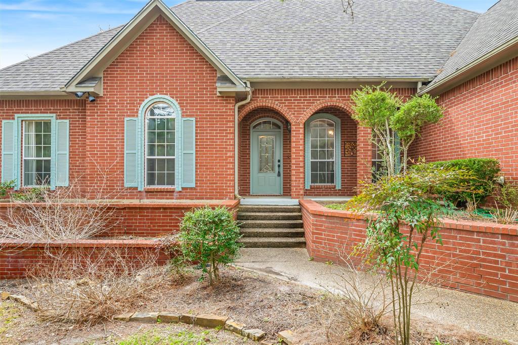 Fantastic curb appeal on this 4BD-2BA-2LA Golf Course home at Holly Lake Ranch. Well built, one story custom home has extensive crown molding and 10' ceilings throughout. Spacious living room features WBFP & built-in cabinetry, and flows into the breakfast room & kitchen area. Kitchen has pantry, dining bar, and was updated in 2022 with granite counter tops & SS appliances. Split bedroom floor plan with primary en-suite that has separate lavatories, walk-in shower, garden tub & walk-in closet. Flex room is perfect for hobbies, workout or second living space. This is a wonderful home ready for your personal touches. NEW ROOF 2024 & water heater 2026. Oversized garage offers a motorized platform lift to floored attic for easy storage. Outside amenities include sprinkler system in front, beautiful rock retainer wall framing the front of the property, extra paved parking in front and driveway extends past garage to pad in back for boat or RV. In the back there's an enjoyable screened-in porch, open deck, flagstone patio & storage building or small workshop.