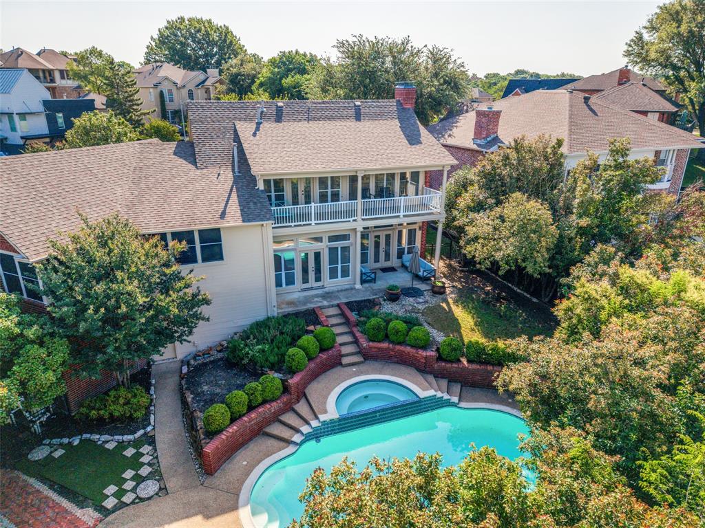 Lakeside resort-style living in gated Chandlers Landing, just 45 minutes from Dallas. Relax by the private pool, enjoy peaceful hillside walks beneath mature trees, and cruise by golf cart to the waterfront restaurant for unforgettable lakeside sunsets. Situated on a peaceful cul-de-sac, this home offers classic brick curb appeal, an extended driveway, and a flexible split-level floorplan. Main level living and dining spaces overlook the pool, creating an easy indoor-outdoor flow. The owner's retreat is privately tucked away on the second floor along with a dedicated study. Top-level living area opens to a balcony with expansive sky views and a glimpse of the lake with two additional generously sized bedrooms connected by a full bath. Outdoor living includes a pool, patio, and cabana with shower and bathroom plumbing in place for future enhancements. 2021 HVACs and 2023 water heater. Offered AS-IS and priced with your added updates in mind. This is an opportunity to bring your vision and create something special! Residents enjoy community pools, tennis courts, parks, walking trails, lake access, and the unique lifestyle that has made Chandlers Landing one of Rockwall's most beloved lake communities.