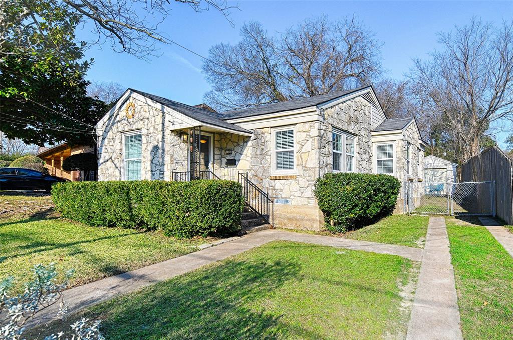 Darling stone cottage on a street lined with crepe myrtle trees.  Across the street is a lovely green space for kids and dogs to play.  The home is walking distance to walking paths, a park, a dog park, coffee shops, the dart rail and the brewery and shops at Tyler station; Elmwood is a desired area everyone can enjoy.  Plus it is a short drive to Bishop Arts and Trinity Groves restaurants and shopping!  The home feels larger than it is bc of it's open living and dining area with access to the kitchen and good sized bedrooms.  The primary bedroom has a custom closet and there is lots of storage.  All windows have nice white slat blinds.  Outside there is an area for grilling and nestled in the trees is a stone firepit perfect for smores and gatherings.