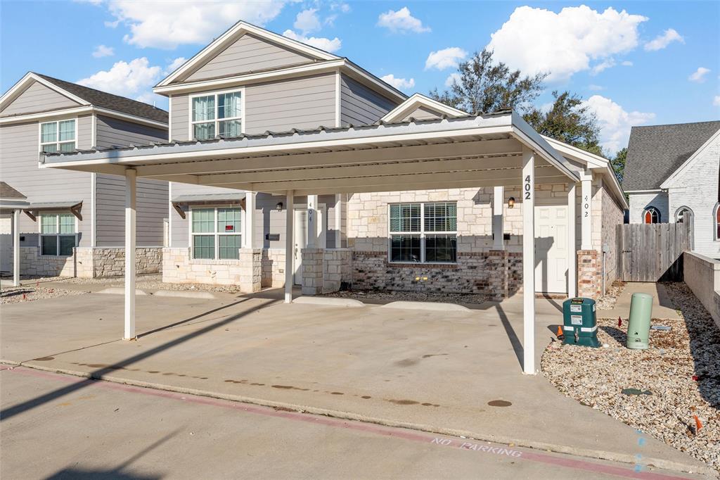 Discover easy living in this beautifully designed 2 bedroom, 1 bath townhome in McGregor! Built in 2018, this home offers modern finishes and thoughtful features throughout. The open concept layout is highlighted by concrete floors, crown molding, and custom-made cabinetry. The kitchen shines with stainless steel appliances and great storage. All while connecting seamlessly to the living area. The oversized, walk-in tiled shower provides enhanced accessibility, making this home comfortable for every stage of life. Included washer and dryer Additional conveniences include washer & dryer and EV charger on the outside of the house. Step outside to a covered patio and private backyard, the perfect spot to unwind or let a pet enjoy the outdoors. Two reserved covered parking spaces keep your vehicles protected from the Texas sun. Whether you’re a first-time buyer, looking to downsize, or searching for an excellent investment opportunity, this move in ready townhome delivers quality, comfort, and location. Welcome home!