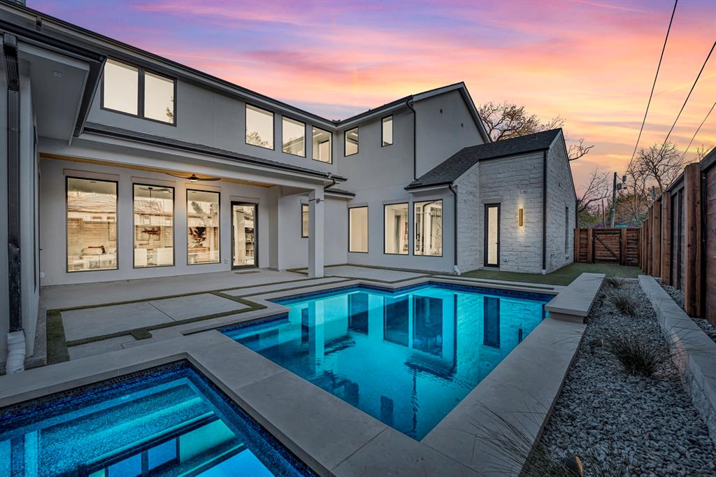 Nestled in the heart of Lakewood proper, this remarkable property built by Brandie Homes and designed by Emerson James sits on a prime corner lot with thoughtful detail at every turn.  Home features a modern floor plan that begins with a stunning foyer and is complemented with unique features  including sophisticated wallpaper and designer tile throughout. 
With five bedrooms, including two downstairs, this home offers both privacy and convenience. The layout also includes a spacious game room, two washer dryer rooms, powder bath, and mudroom.
The design combines timeless and modern elegance graced with a Wolf range, Subzero refrigerator, and luxurious prep kitchen that is as stylish as it is functional.

Step outside into your backyard oasis complete with a sparkling pool, firepit and turf area. This home truly embodies the optimal blend of charm and sophistication all within close proximity to White Rock Lake, Lakewood Elementary, Lake Hill prep, lush parks, and Lakewood’s renowned dining and shopping.