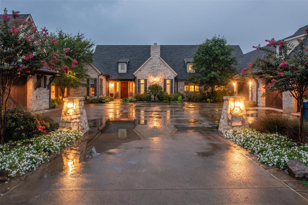 This stunning, custom home on a beautifully landscaped creek lot was built by Ron McHam.  Some of the features include: full stone exterior, open layout, split ensuite bedrooms, a 2 room office with private entrance and fireplace, full foam insulation, central vac, double bathrooms in the primary suite, library that connects to one of the primary closets, tornado shelter, large covered porch and patio, 4.5 car garage with walk up storage space.  Private patio off the primary bedroom. A laundry room with bountiful storage.  A double entry pantry with fridge and custom cabinets throughout the kitchen and coffee bar.  So many things!!  You won't want to miss it!