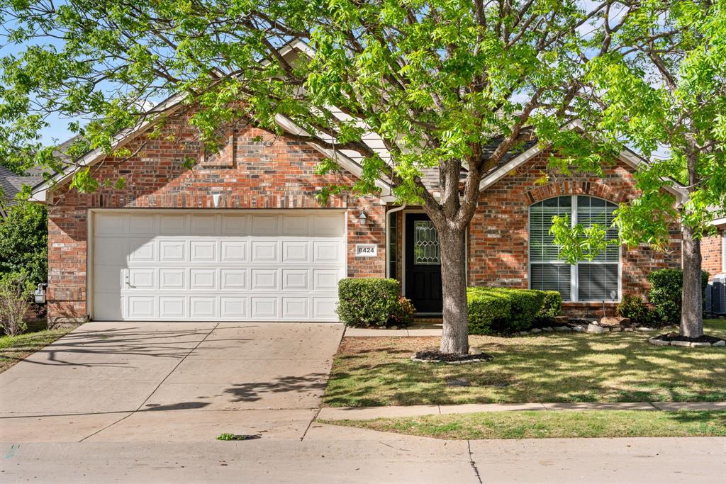 Charming and move-in ready, this 3-bedroom, 2-bath home offers a warm, functional single-story layout! Enjoy both a formal living room and an elegant formal dining room with beautiful wainscoting. The spacious kitchen opens to the inviting family room and features black granite countertops, a gas cooktop, abundant cabinet storage, a breakfast nook, and a bar-top island with room for several stools. Cozy up by the gas fireplace in the family room, or retreat to the private primary suite with two walk-in closets, a dual sink vanity, a relaxing soaking tub, and a separate shower. Two additional bedrooms share a full bathroom. A 2-car garage, laundry room with shelving, and a large grassy backyard complete the home. The interior was recently given a fresh coat of paint. Conveniently located in west McKinney near shopping, dining, and major commuter routes, with access to highly rated McKinney ISD schools.