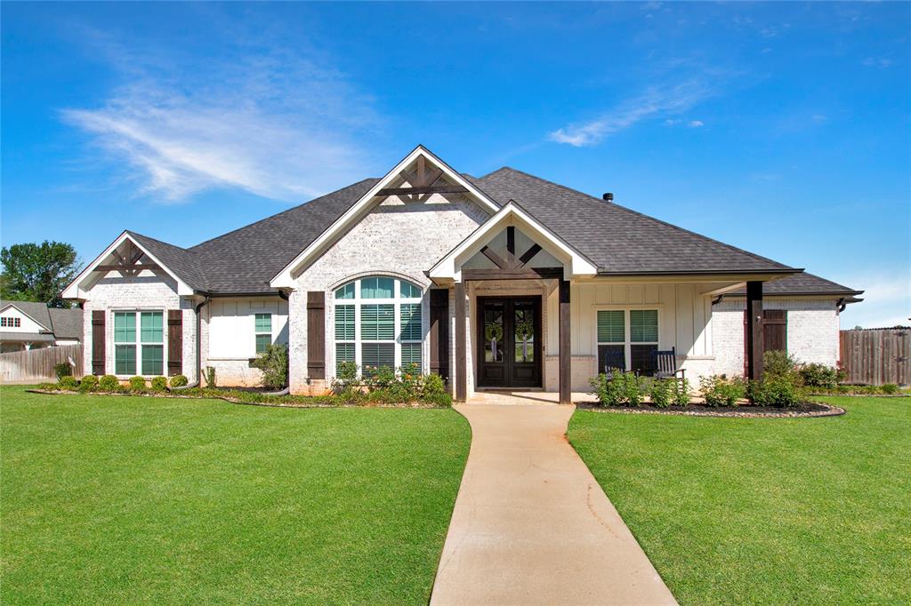 Welcome to this stunning 4-bedroom, 2.5-bathroom home with a 2-car garage offering 2,606 square feet of beautifully designed living space in the desirable Windsor Estates in Bullard. Perfectly positioned on a corner lot, this home offers space, style, and a prime location.

From the moment you arrive, you’re greeted by a bright exterior with eye-catching architectural details including wood beams and unique curved windows. Step inside to a welcoming dining area featuring high ceilings, elegant light fixtures, a stylish accent wall, and even a built-in coffee bar space for added convenience.

The living room opens seamlessly to the kitchen and showcases soaring ceilings with wood beams, a beautiful fireplace, built-in shelving with cabinetry, and large windows that fill the space with natural light. Thoughtful lighting and design elements continue throughout, creating a warm and inviting atmosphere.

The kitchen is both functional and full of character, featuring a large island with seating, distinctive light fixtures, a custom vent hood, abundant cabinet storage, and generous counter space—perfect for cooking and entertaining.

The primary suite is a true standout, featuring wood beam ceilings, stunning lighting, and an open, airy feel with plenty of natural light. The primary bathroom offers ample cabinet storage, a beautiful soaking tub, and an oversized walk-in shower that is thoughtfully tucked away for added privacy.

Additional bedrooms are spacious and full of unique details, while the bathrooms continue the home’s stylish design with plenty of room and storage.

Step outside to enjoy a large covered patio with plenty of space for entertaining, an expansive backyard ideal for kids or pets, and a beautiful pergola that adds even more charm to the outdoor space. This home truly stands out with its thoughtful details, spacious layout, and exceptional setting.