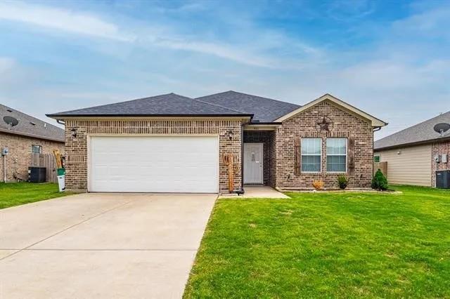 This beautiful 100% brick home in Greenville is for sale. It has 3 bedrooms, 2 full baths and a large 2-car garage. All walls and ceilings have been repainted recently. The primary bedroom has a coffered ceiling along with an ensuite bathroom and walk in closet. It is separated from the other 2 bedrooms for privacy. Both bathrooms have a custom tile surround. There is no carpet in this house. The other flooring is either tile or luxury vinyl plank. The spacious kitchen has new stainless steel appliances. The huge living area is great  for entertaining or relaxing.  All rooms have 9 ft ceilings. Every room has ceiling fans except the bathrooms and laundry. There is a large fenced in back yard which includes a fire pit.  Home is conveniently located close to downtown Greenville. This home is also located within the Greenville ISD. This house is also for lease. See MLS # 21192511. 1st accetable offer will be chosen.