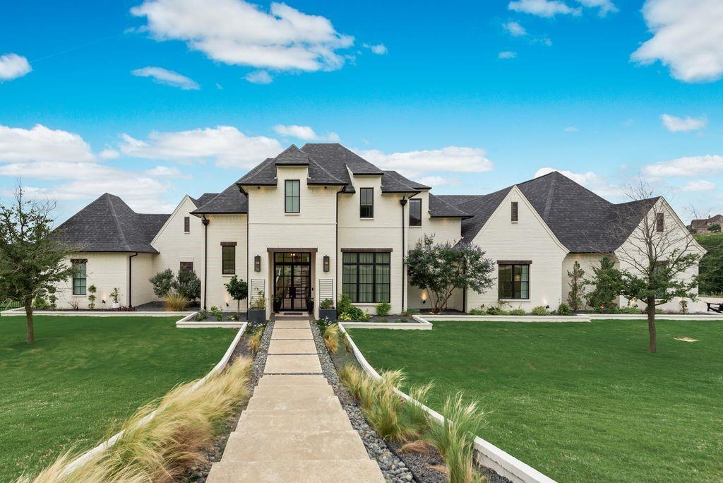 Back on Market! Experience elevated Texas living in this exceptional 5-bedroom, 3.5-bath custom luxury home built by Brabec Custom Homes in 2021, perfectly situated on over 1.5 acres at the end of a quiet cul-de-sac in the highly sought-after Aledo ISD.  With breathtaking panoramic views, stunning curb appeal, and a private resort-style backyard oasis, this extraordinary property was thoughtfully designed for luxury living and effortless entertaining. Inside, soaring ceilings, designer finishes, expansive living spaces, and walls of windows fill the home with natural light while framing the picturesque surroundings. The open-concept floor plan seamlessly blends elegance and functionality, creating an inviting atmosphere throughout. The chef-inspired kitchen features premium Bertazzoni appliances, gorgeous quartz countertops, oversized gathering spaces, a large center island, abundant storage, and custom soft-close cabinetry—perfect for hosting family and friends. Thoughtful custom details and high-end finishes can be found throughout every space of the home, including a dedicated office ideal for working from home. The secluded downstairs primary suite offers a peaceful retreat with a luxurious ensuite bath and spacious walk-in closet. A secondary downstairs bedroom with private ensuite bath is ideal for guests or multigenerational living. Upstairs, you’ll find three additional bedrooms, a spacious second living area, and an impressive media room perfect for movie nights, game days, or entertaining.  Step outside to your own backyard paradise complete with a stunning pool, expansive covered patio spaces, and endless room to relax or entertain year-round while enjoying the incredible views and privacy this property offers. The 4-car garage features durable epoxy flooring, providing both functionality and a polished finish. Conveniently located near Hwy 377 in Bella Crossing this one-of-a-kind luxury estate combines sophistication, comfort, privacy, and convenience.